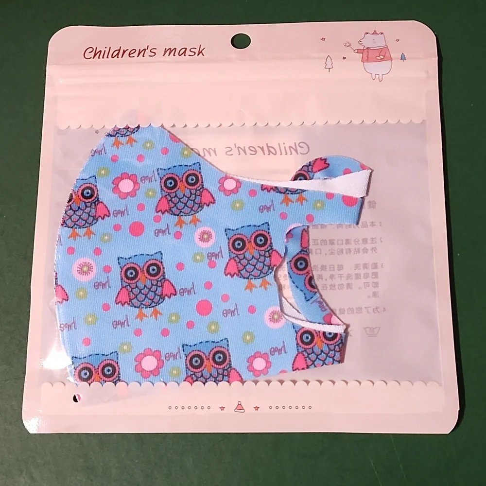 Children's re Usable face mask new in package never opened